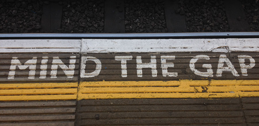 Mind the gap written on concrete